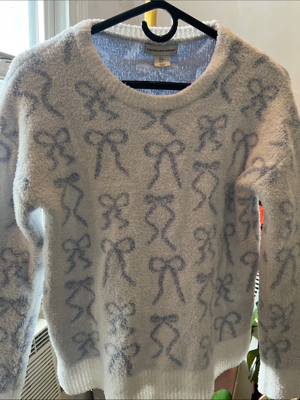 cupcakes & cashmere White sweater with light blue bow pattern